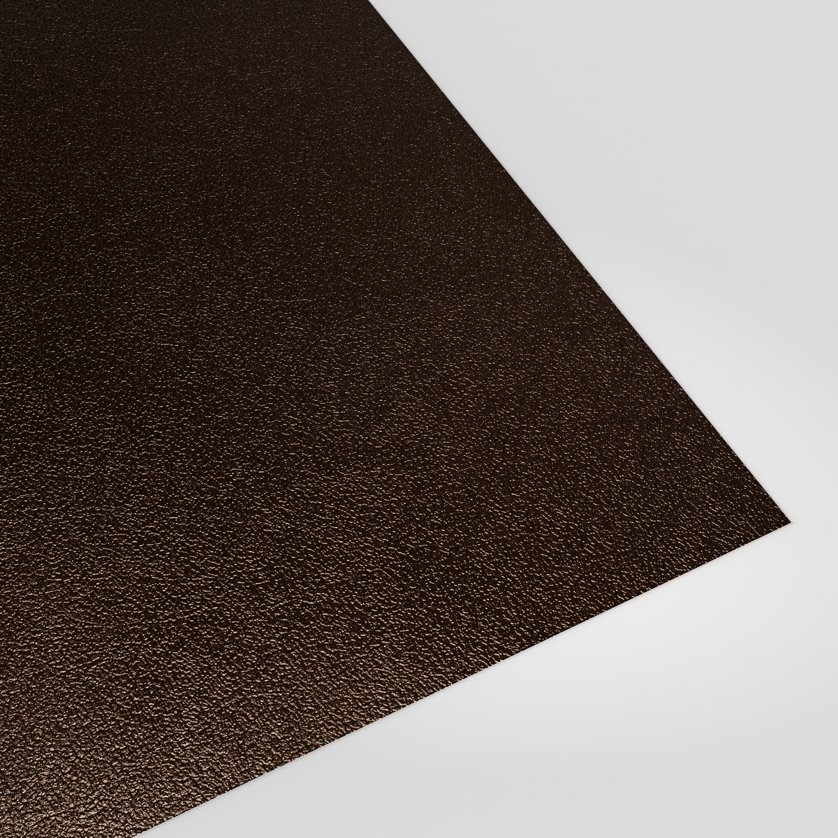Flat metal sheet in Van Dyke Brown (dark brown) PVC Plastisol, grained finish, angled studio view