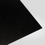 Flat metal sheet in Black PVC Plastisol, grained finish, angled studio view