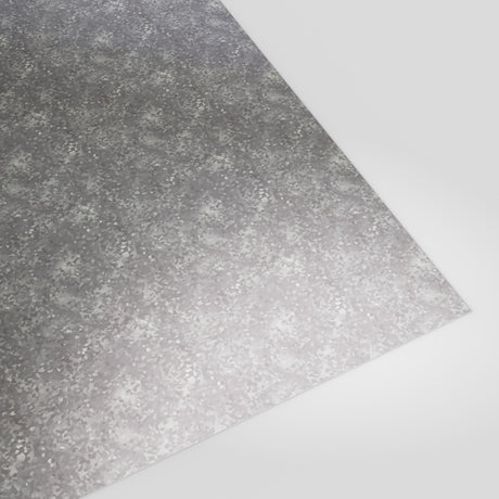 Flat 0.7mm galvanised steel sheet with spangled zinc finish, angled studio view