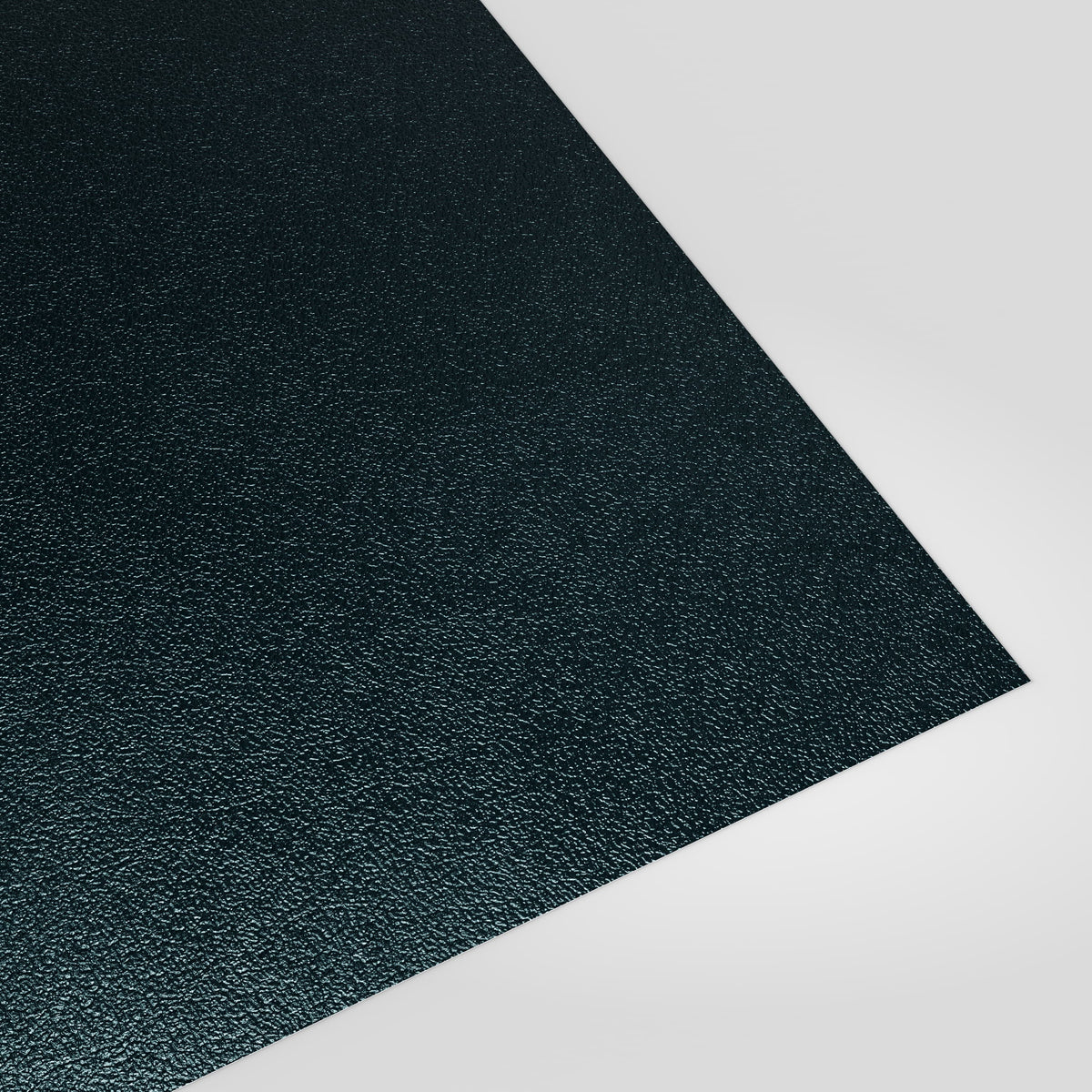 Flat metal sheet in Slate Blue (dark blue-grey) PVC Plastisol, grained finish, angled studio view