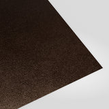 Flat metal sheet in Van Dyke Brown (dark brown) PVC Plastisol, grained finish, angled studio view